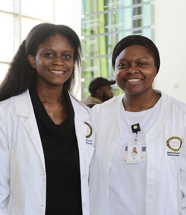 two students during white coat ceremony
