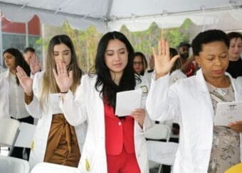 Students recite their oath during College of Nursing's White Coat Ceremony.