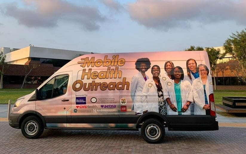 The Mobile Health Outreach Van parked in front of the CDU campus.