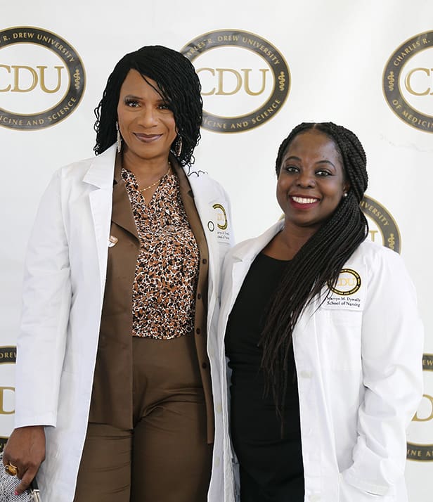 two students after white coat ceremony