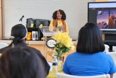Adrienne Milbourne-Thompson, Academic Support Specialist, speaks at event
