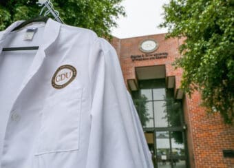 White coat in front of Cobb building