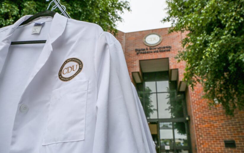 White coat in front of Cobb building