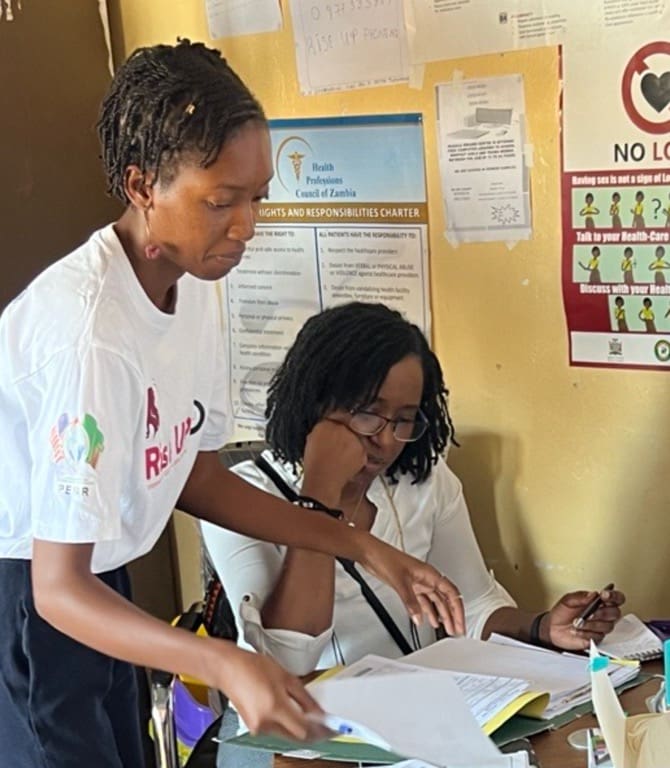 Two women working at a desk