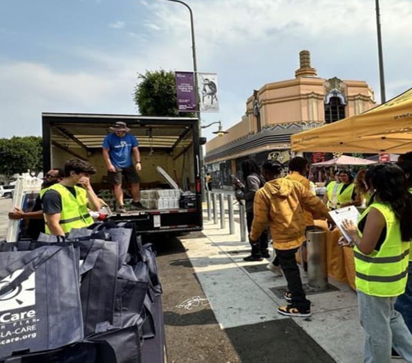 People unloading trucks