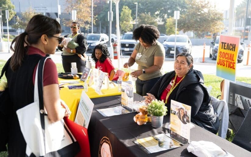 CDU staff members helping community members at resource fair