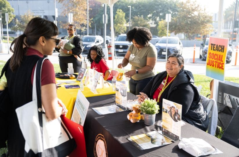 CDU staff members helping community members at resource fair