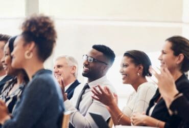 men and women clapping