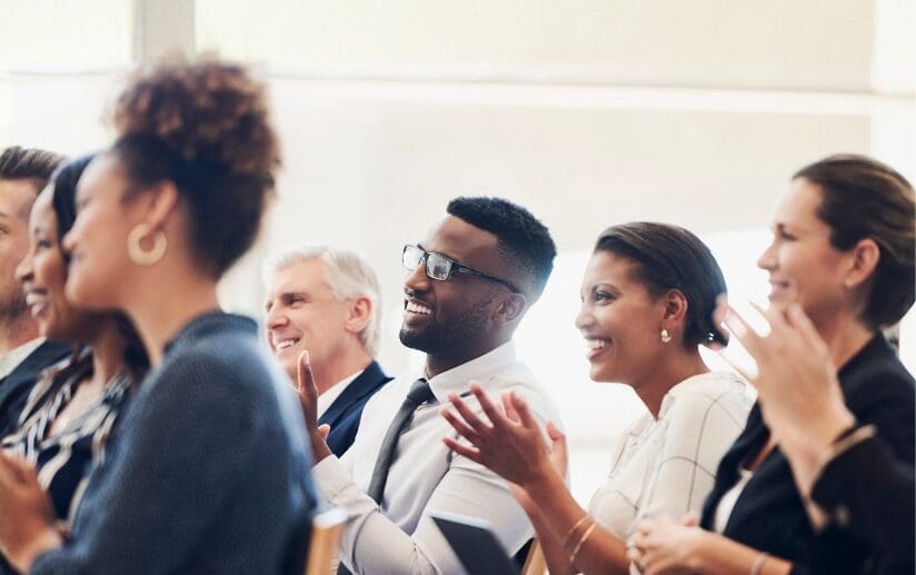 men and women clapping