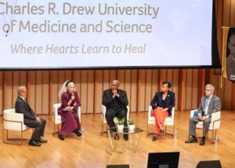 Dr. Carlisle and President's Breakfast panelists seated on stage
