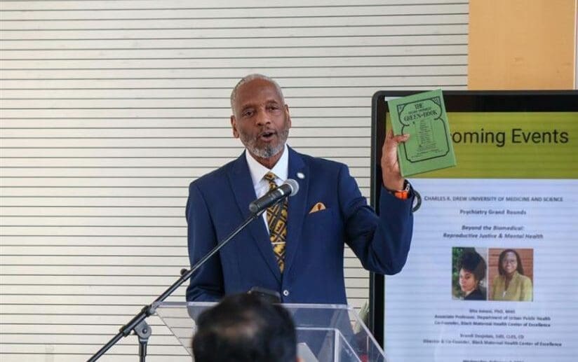 John Patton holding Green Book