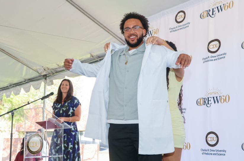 male-student-being-coated