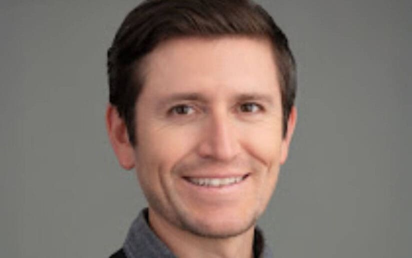 man wearing collared shirt and sweater