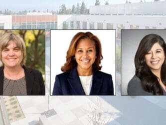 three women wearing business attire