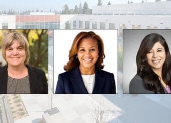 three women wearing business attire