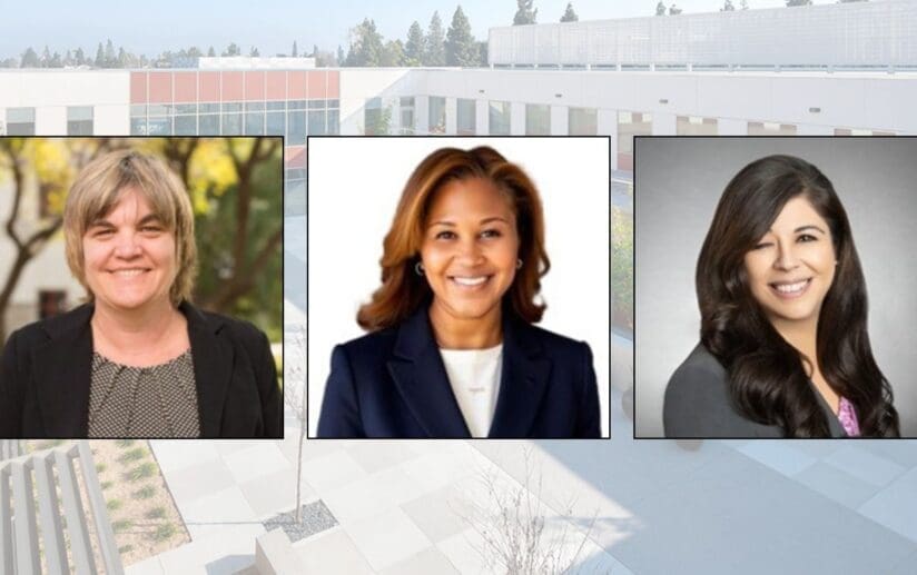 three women wearing business attire