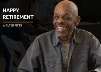 Walter Pitts smiling wearing grey coat