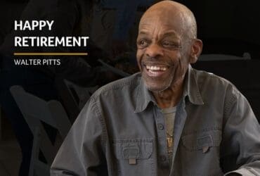 Walter Pitts smiling wearing grey coat