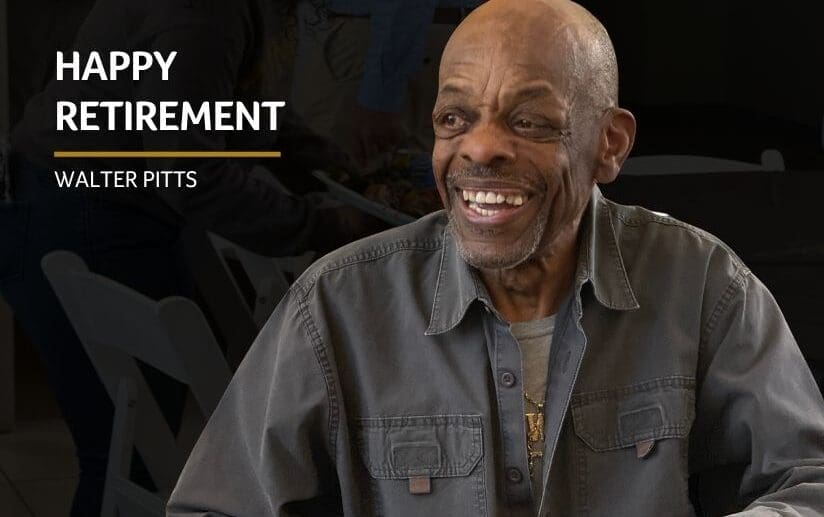 Walter Pitts smiling wearing grey coat