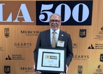 Dr. Carlisle holding LA500 plaque