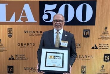 Dr. Carlisle holding LA500 plaque