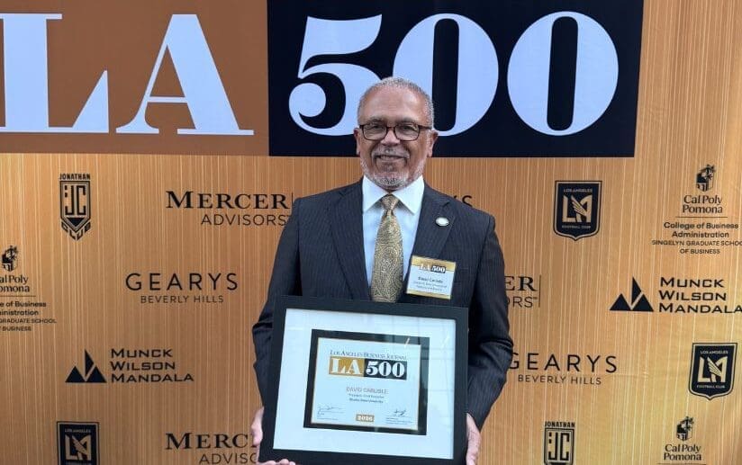 Dr. Carlisle holding LA500 plaque