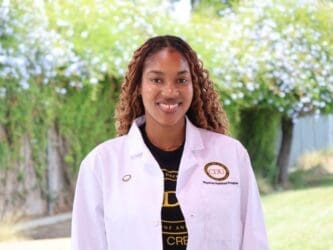 student wearing white coat