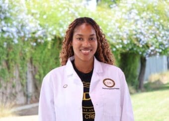 student wearing white coat