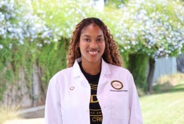 student wearing white coat