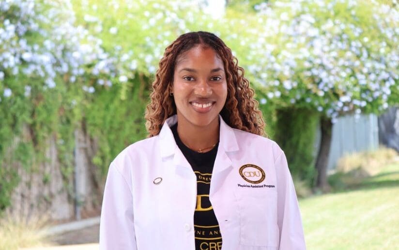 student wearing white coat