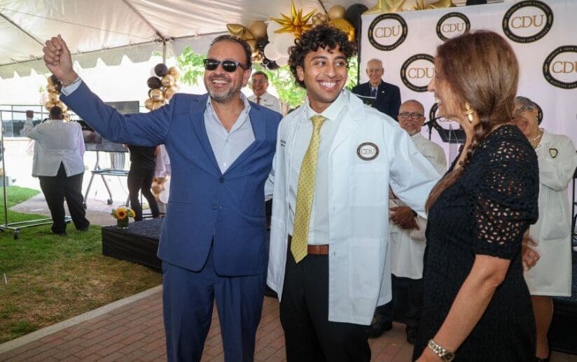 MD student smiling with white coat